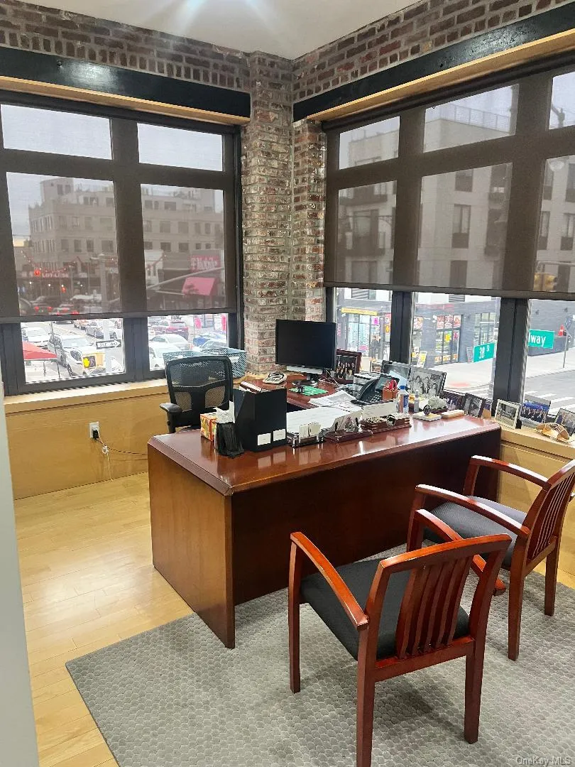 Office area with a city view and brick wall Office area with a city view and brick wall