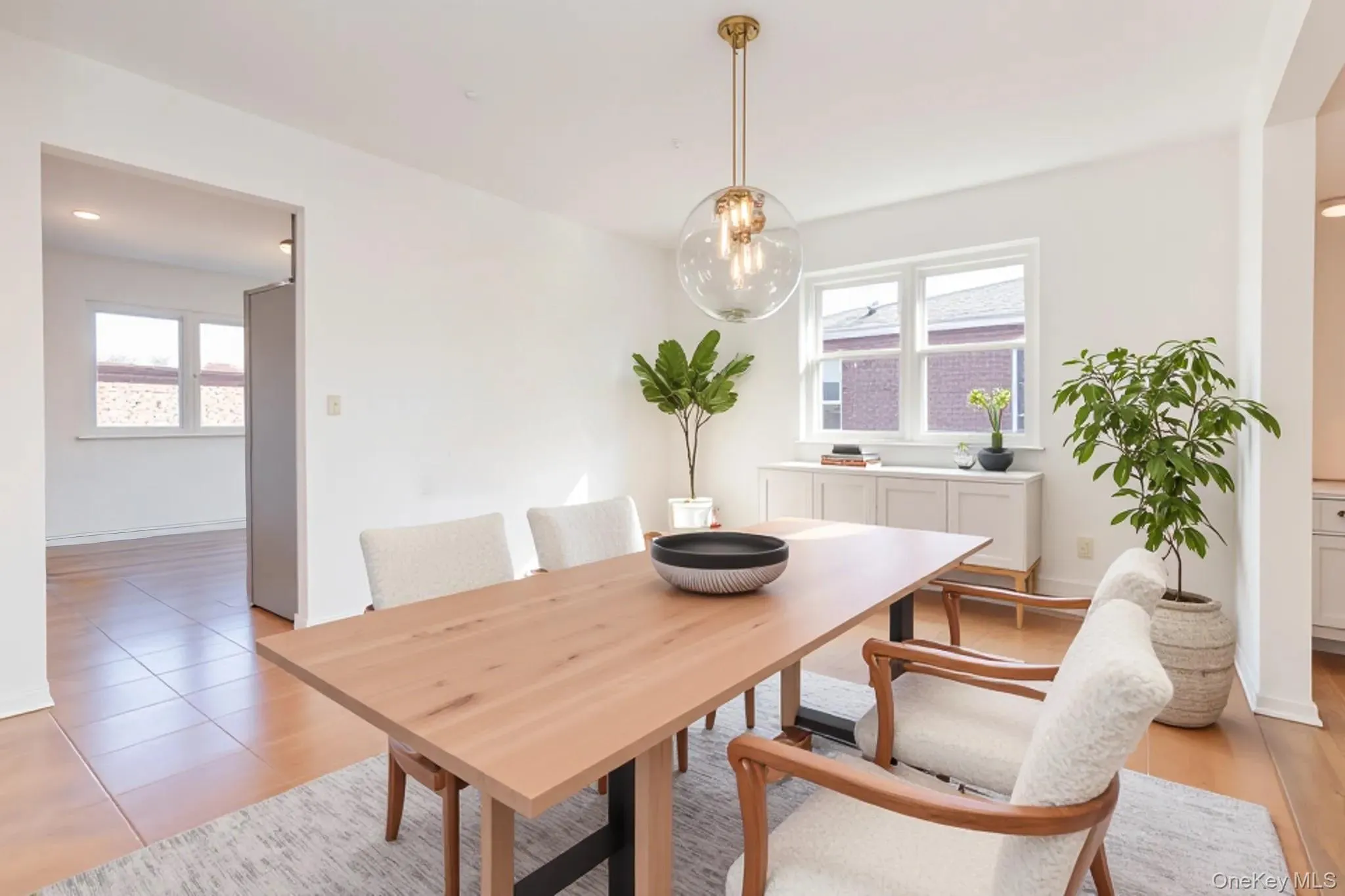 Virtually staged Dining room with plenty of natural light Virtually staged Dining room with plenty of natural light