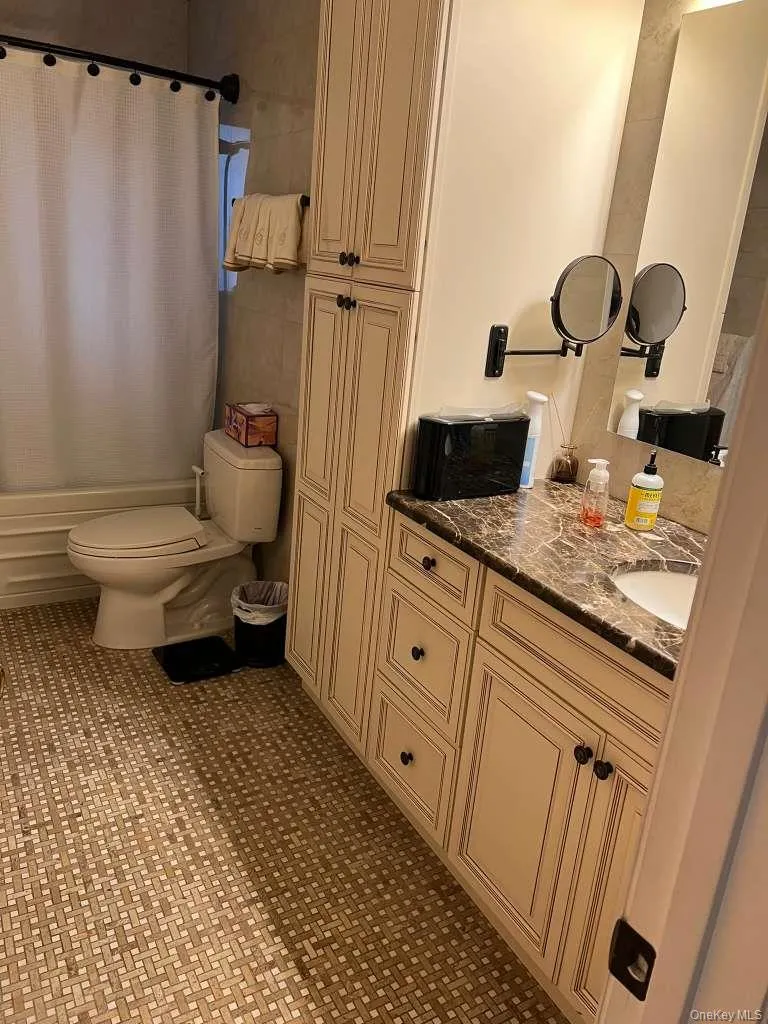 Full bathroom with vanity and shower / tub combo Full bathroom with vanity and shower / tub combo