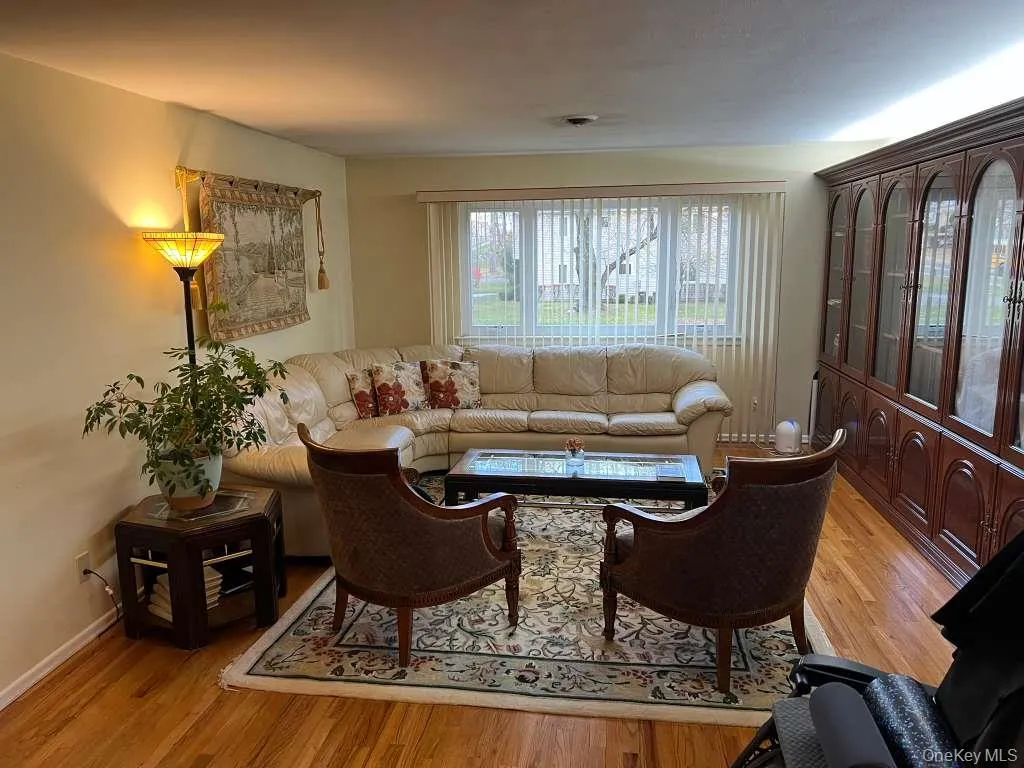 Living area with light wood finished floors Living area with light wood finished floors