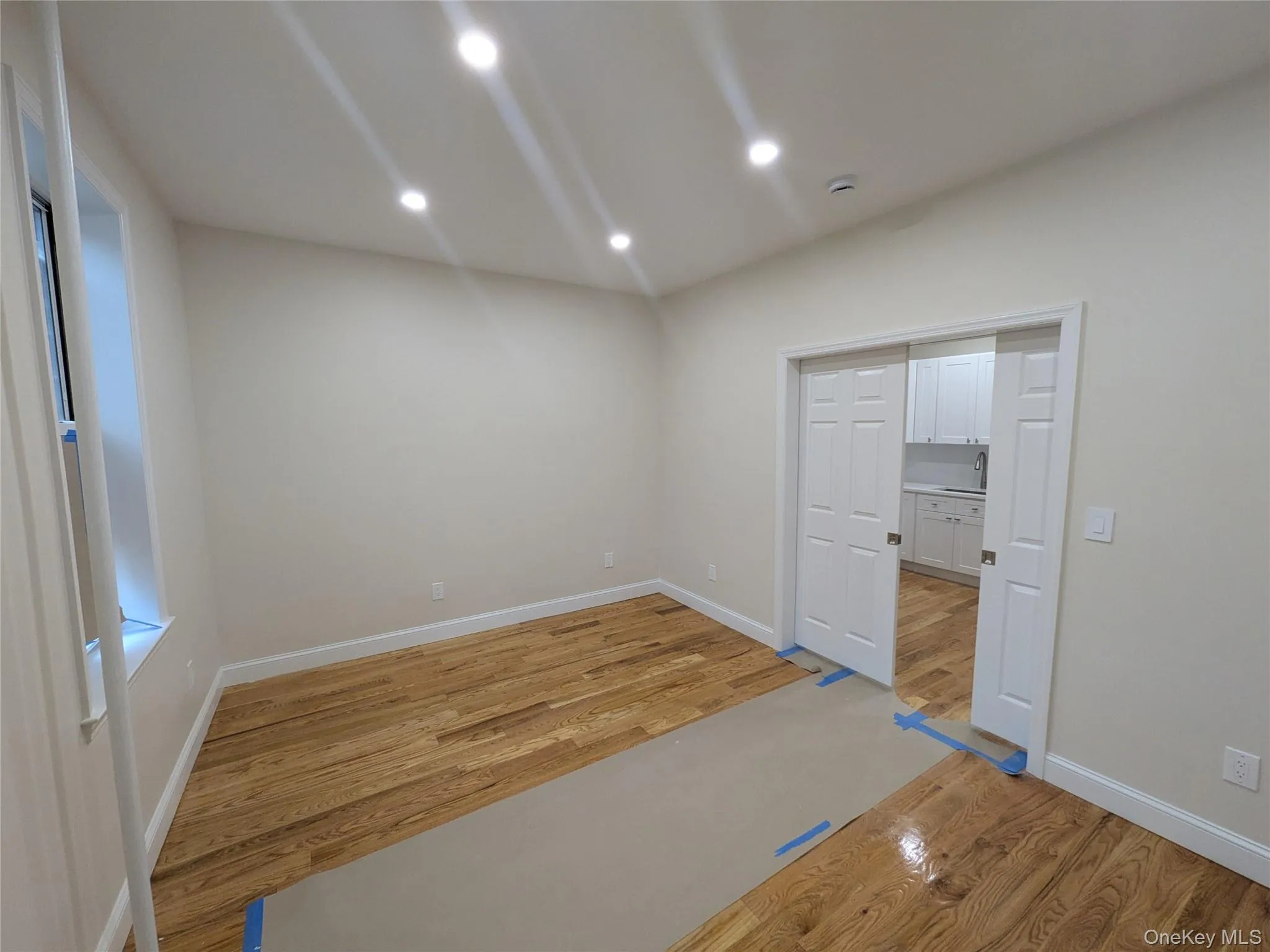 Unfurnished room with light wood-type flooring and recessed lighting Unfurnished room with light wood-type flooring and recessed lighting