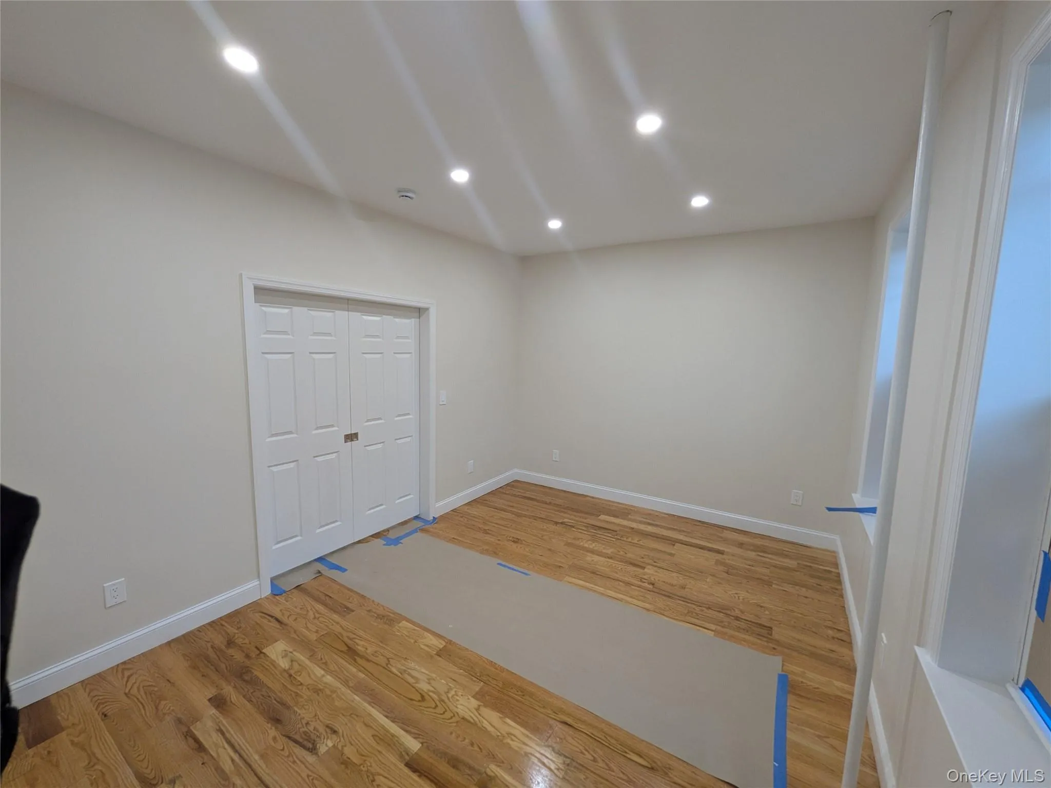 Unfurnished room with recessed lighting and light wood-style floors Unfurnished room with recessed lighting and light wood-style floors