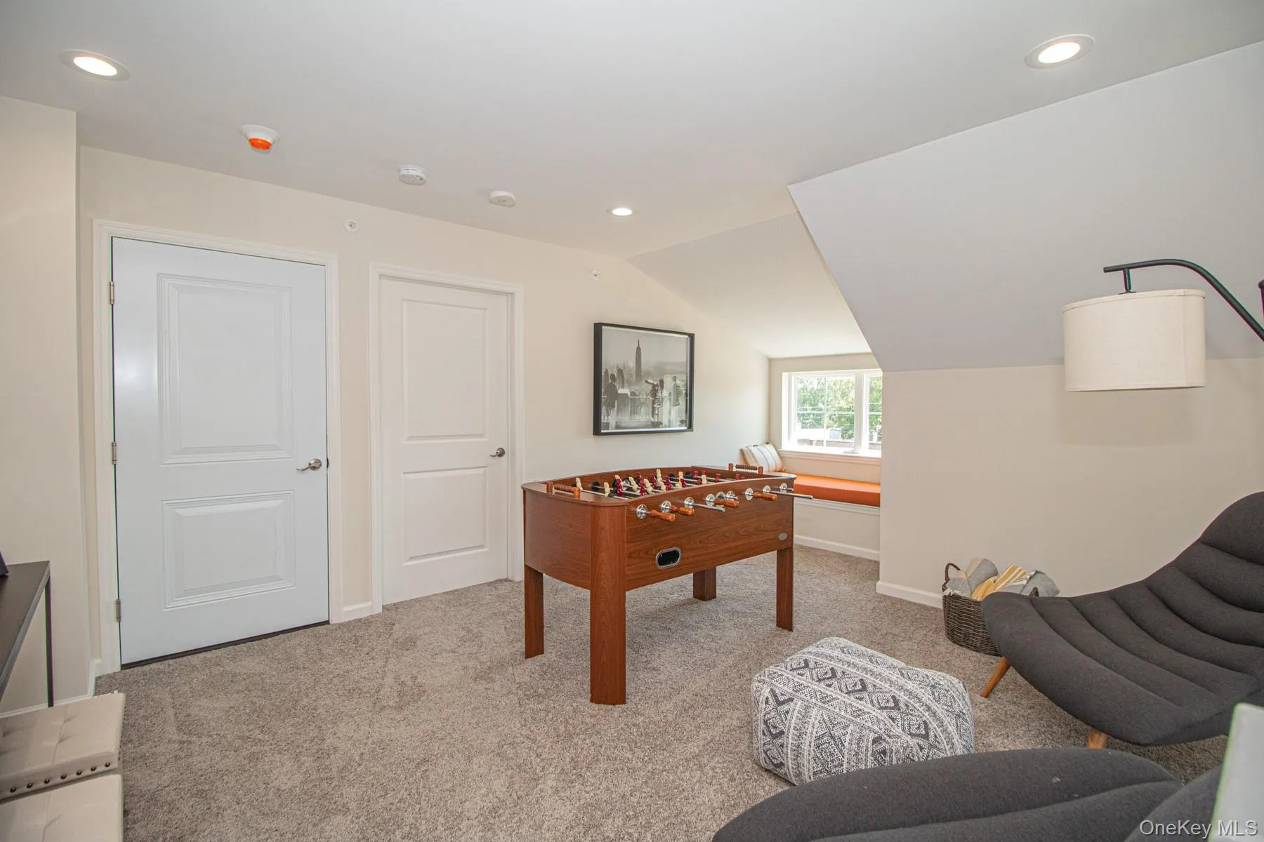 Game room featuring recessed lighting, light carpet, and vaulted ceiling Game room featuring recessed lighting, light carpet, and vaulted ceiling