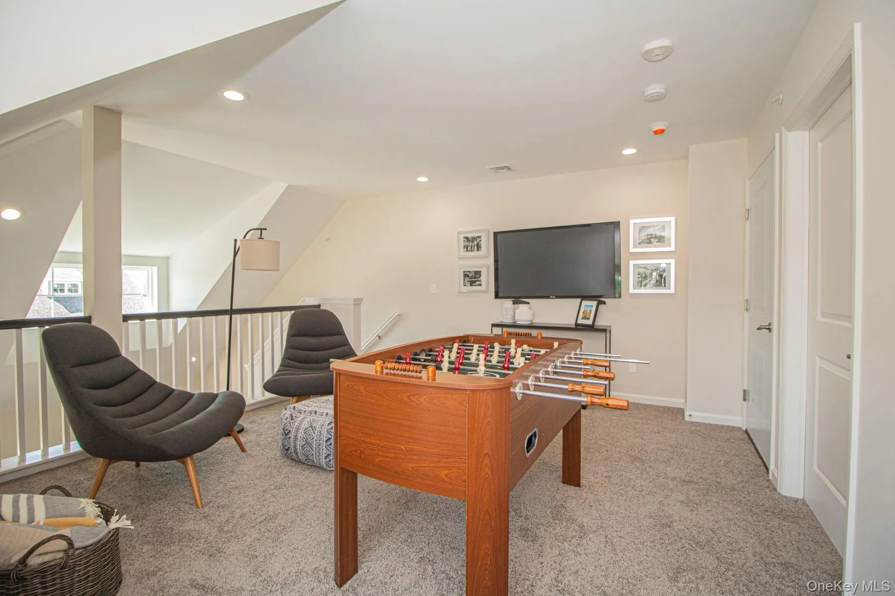 Playroom featuring recessed lighting, carpet floors, and vaulted ceiling Playroom featuring recessed lighting, carpet floors, and vaulted ceiling