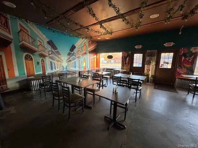 Dining area featuring concrete flooring Dining area featuring concrete flooring