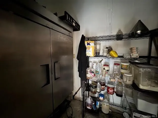 Kitchen featuring stainless steel fridge Kitchen featuring stainless steel fridge