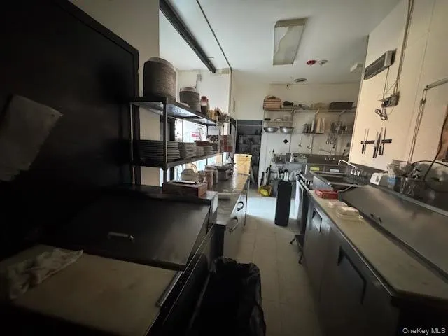 Kitchen with a sink and dark cabinets Kitchen with a sink and dark cabinets