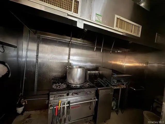 Kitchen with extractor fan and dark cabinets Kitchen with extractor fan and dark cabinets