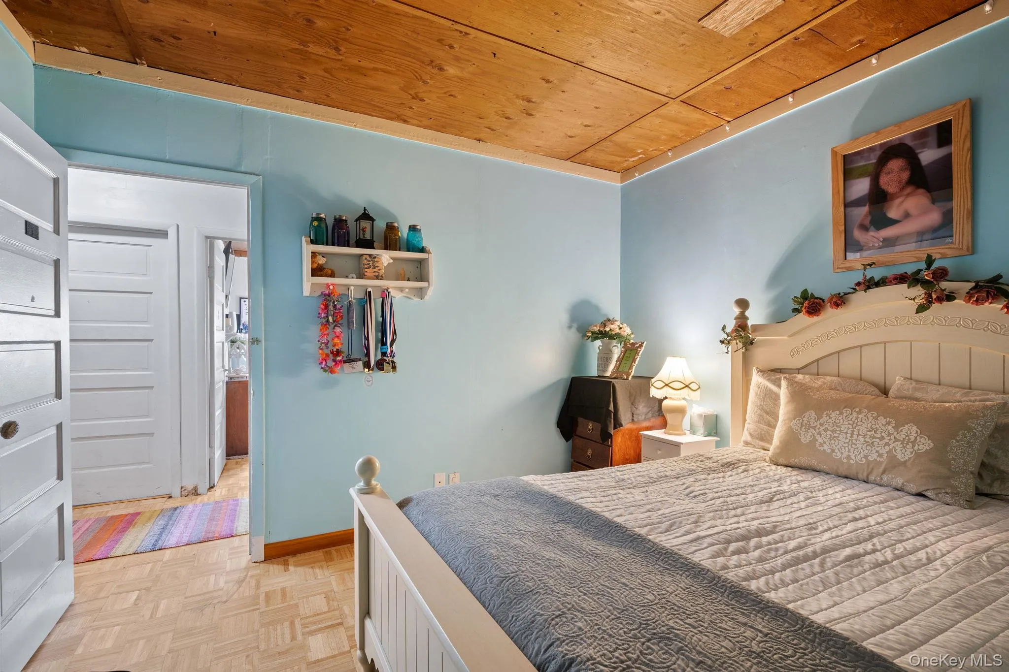 Bedroom featuring wood ceiling Bedroom featuring wood ceiling