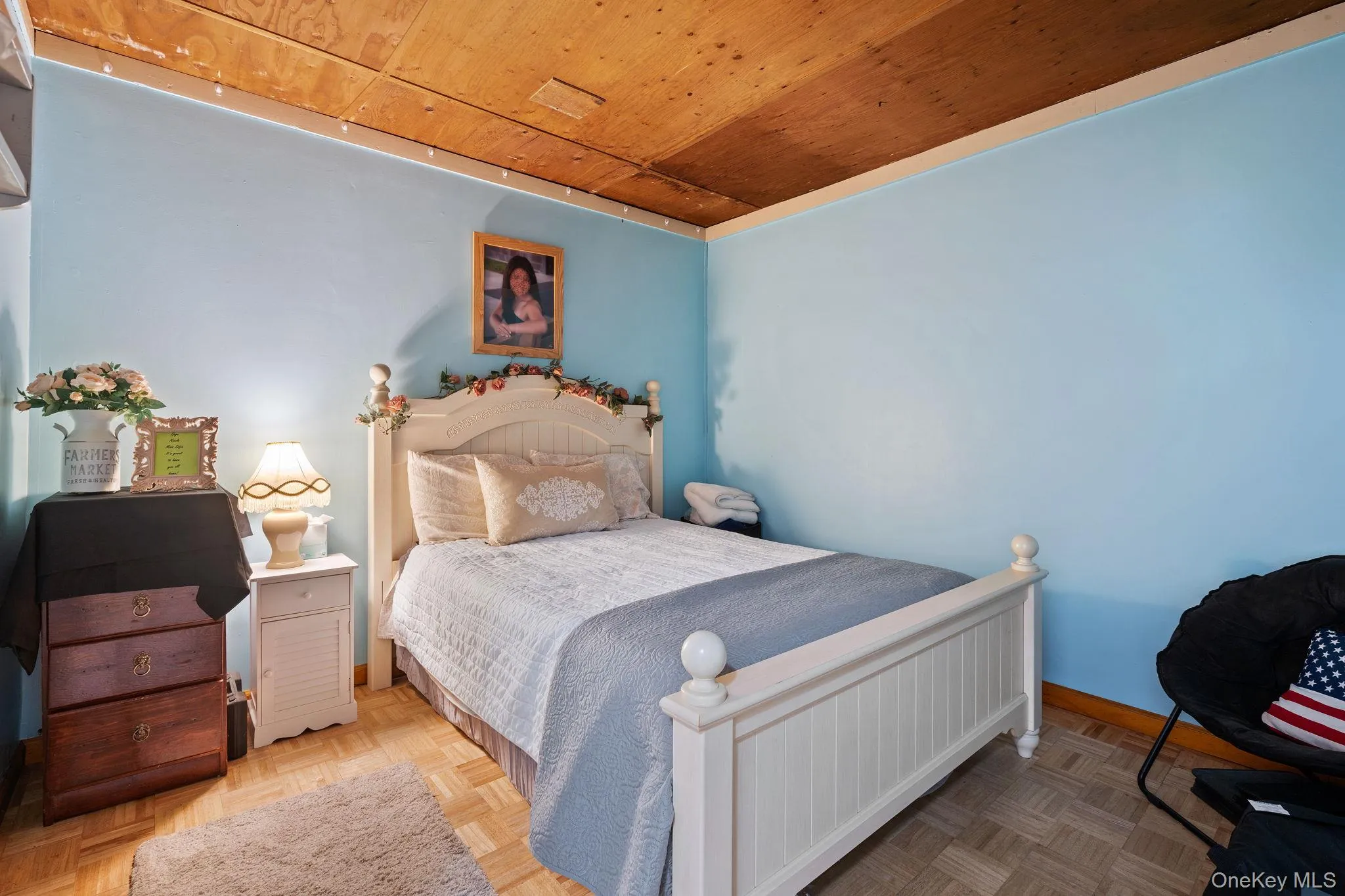 Bedroom featuring wooden ceiling Bedroom featuring wooden ceiling