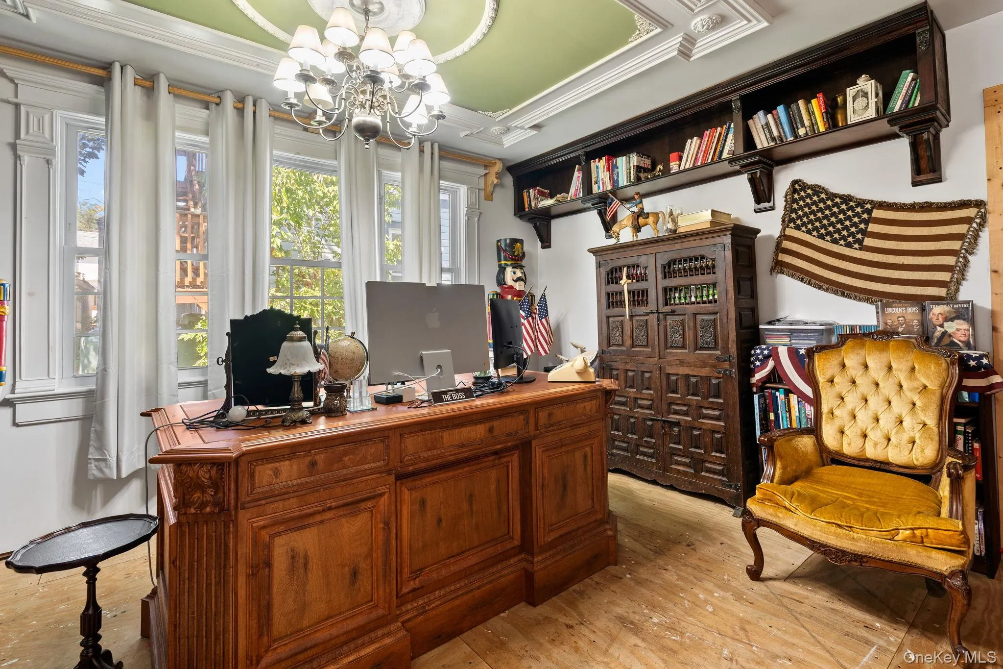 Home office with a chandelier, light wood-style floors, and ornamental molding Home office with a chandelier, light wood-style floors, and ornamental molding