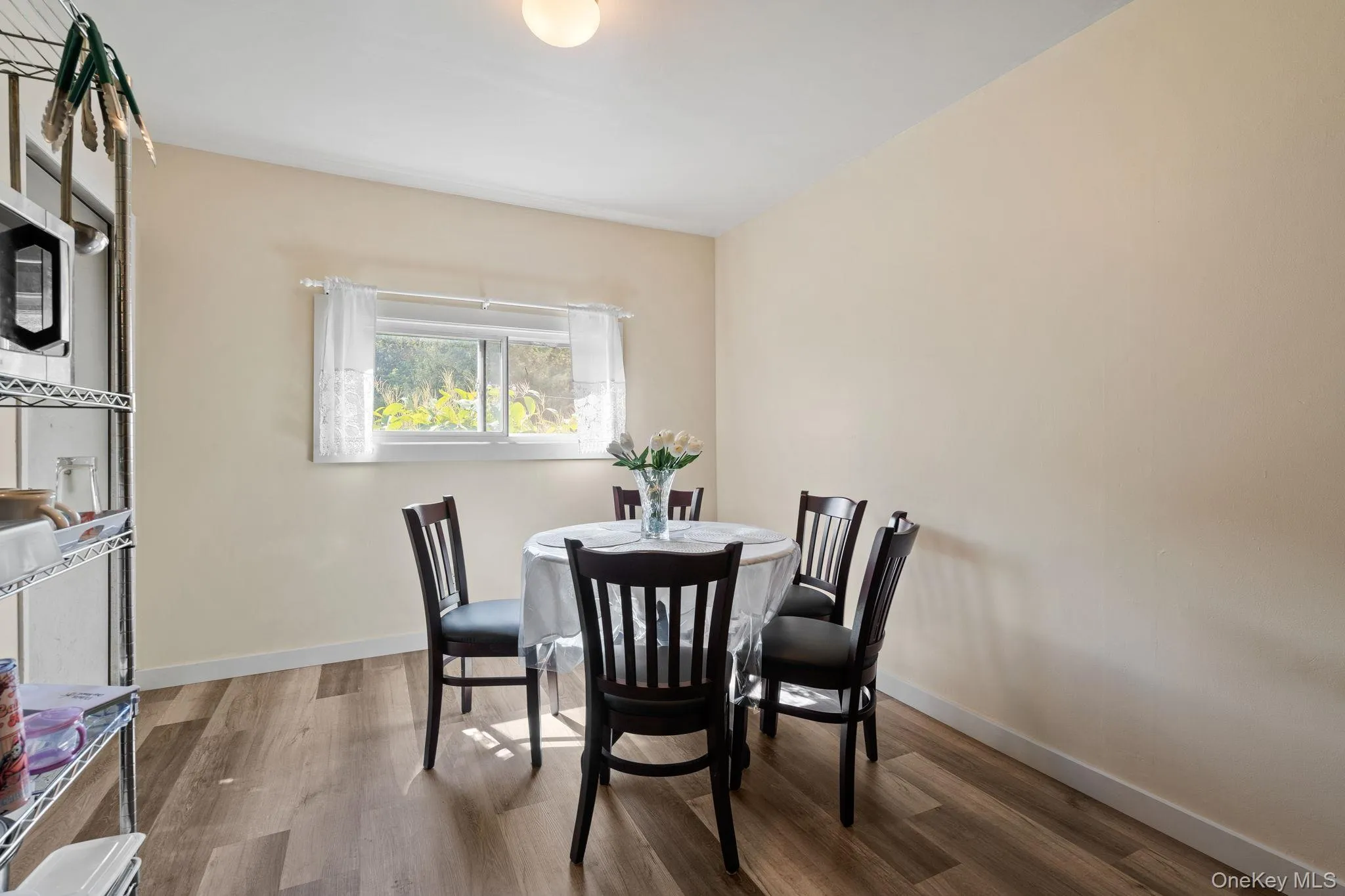 Dining room featuring wood finished floors and baseboards Dining room featuring wood finished floors and baseboards