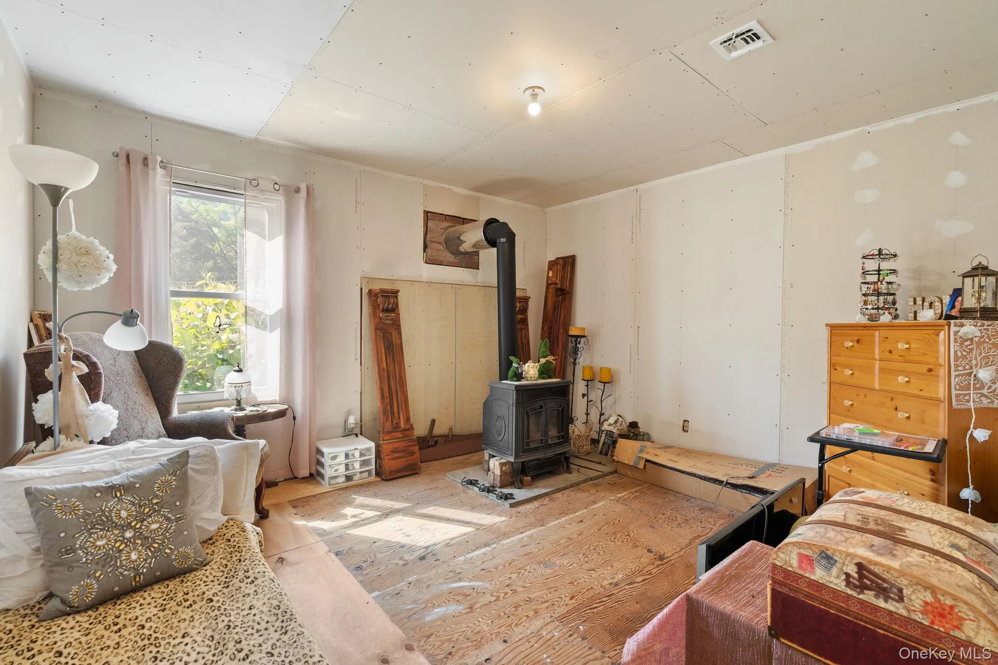 Living room with a wood stove Living room with a wood stove