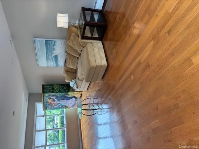 Living room featuring hardwood / wood-style floors Living room featuring hardwood / wood-style floors