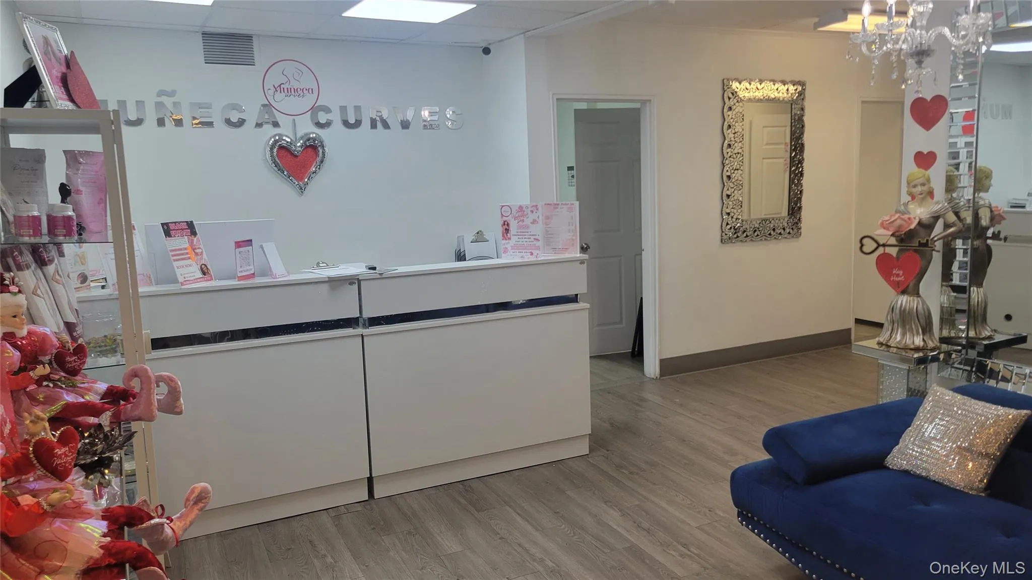 Welcome area featuring a paneled ceiling and a chandelier Welcome area featuring a paneled ceiling and a chandelier