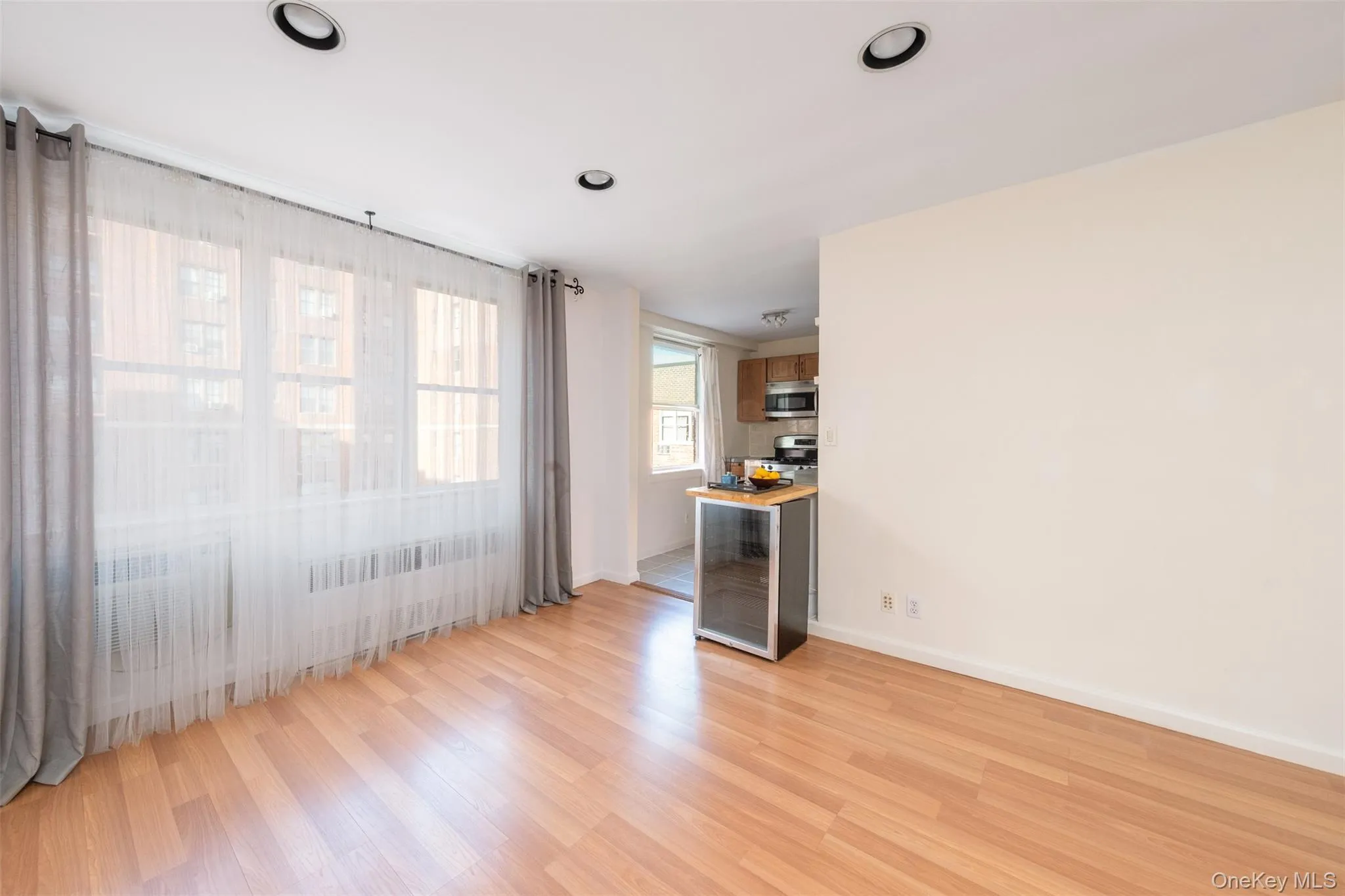 Spare room featuring light wood-type flooring and recessed lighting Spare room featuring light wood-type flooring and recessed lighting