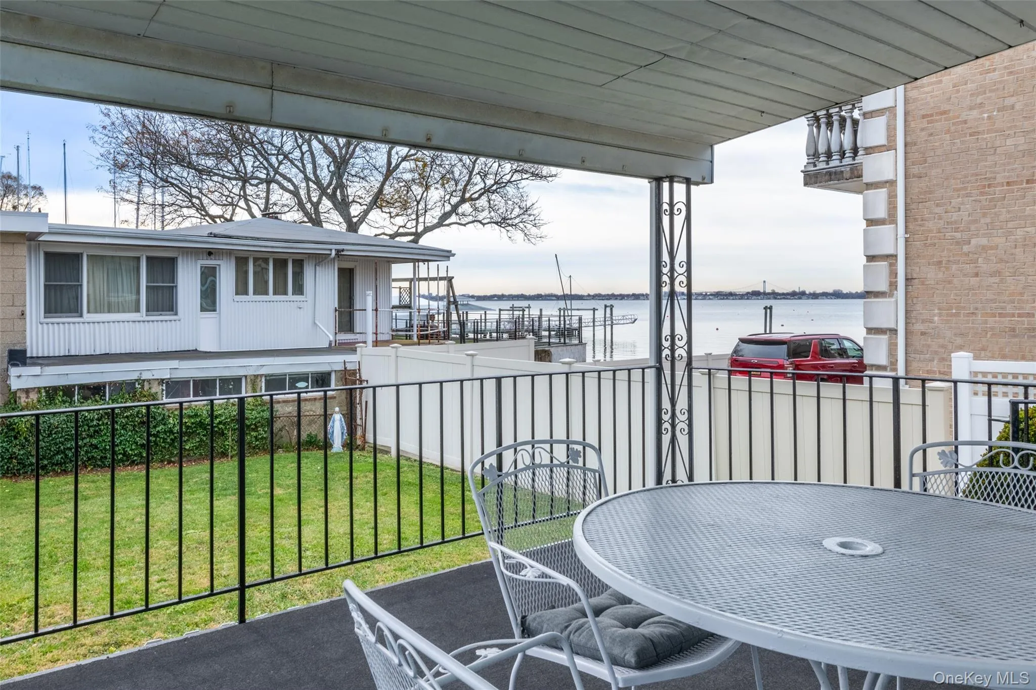Balcony with a water view and outdoor dining space Balcony with a water view and outdoor dining space