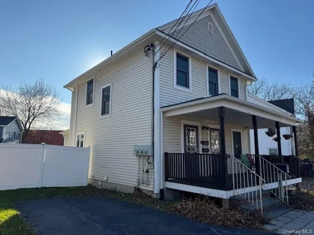 View of side of property with a porch View of side of property with a porch