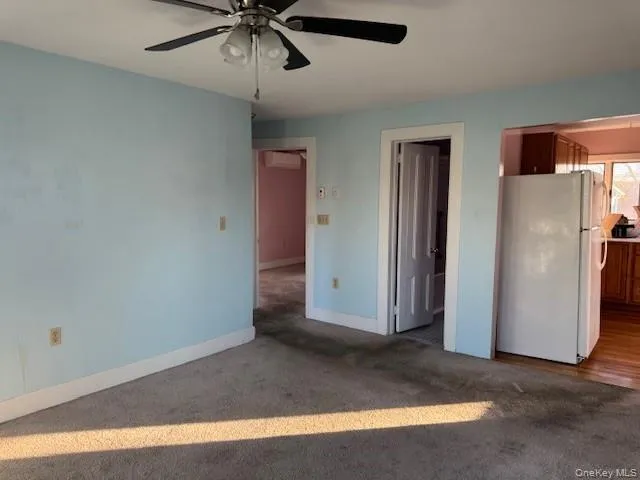 Open to kitchen with doors to bedroom and bathroom Open to kitchen with doors to bedroom and bathroom