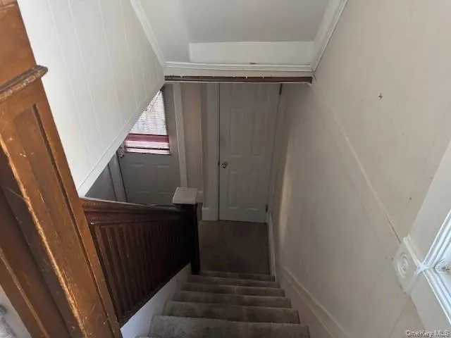 Stairs featuring crown molding Stairs featuring crown molding