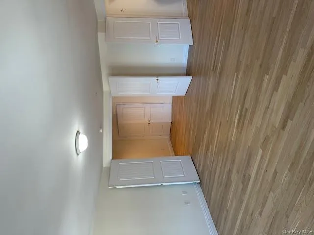 Empty room featuring light wood-style floors and baseboards Empty room featuring light wood-style floors and baseboards