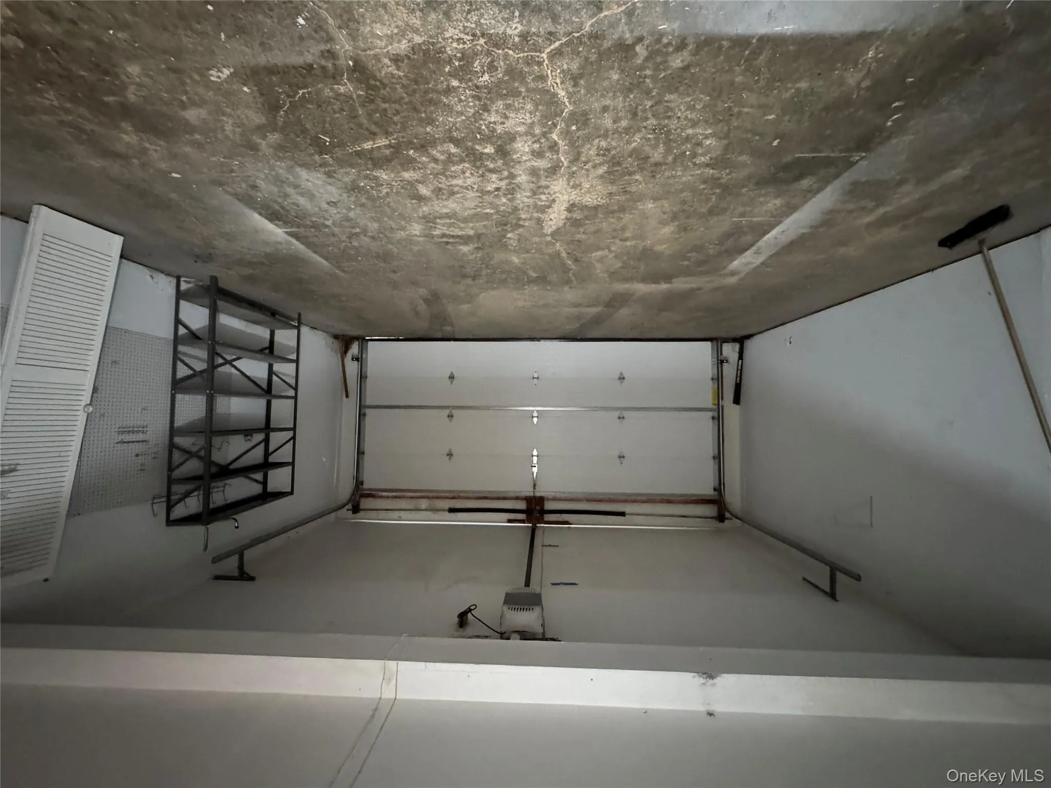 Garage featuring a garage door opener Garage featuring a garage door opener