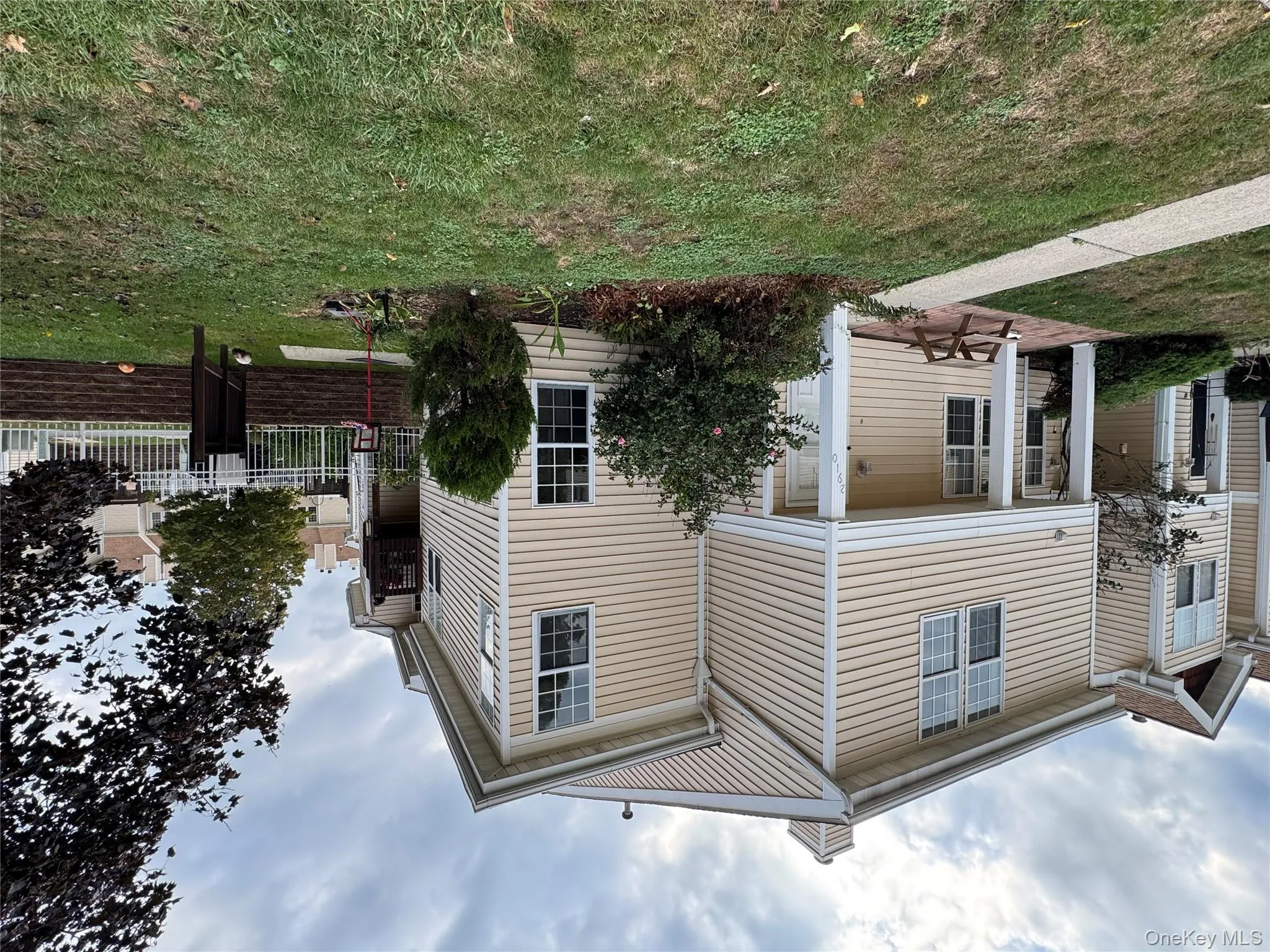 View of home's exterior with a chimney and a patio area View of home's exterior with a chimney and a patio area