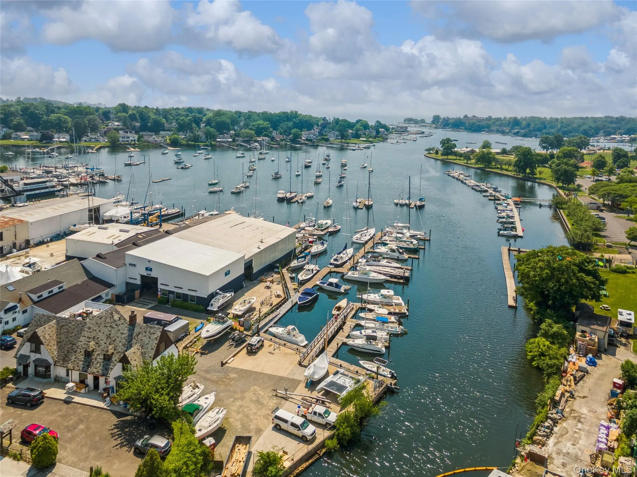 Bird's eye view of numerous boat docks and a large body of water Bird's eye view of numerous boat docks and a large body of water