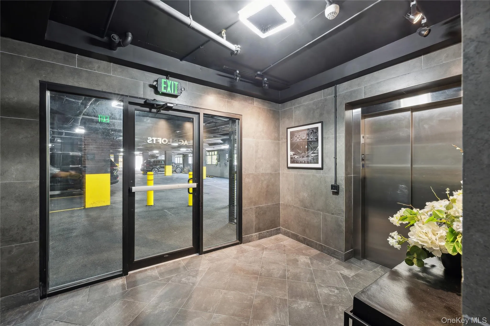 Common area featuring tile walls Common area featuring tile walls