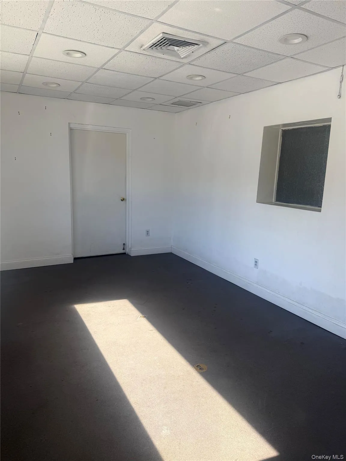 Spare room featuring a paneled ceiling Spare room featuring a paneled ceiling