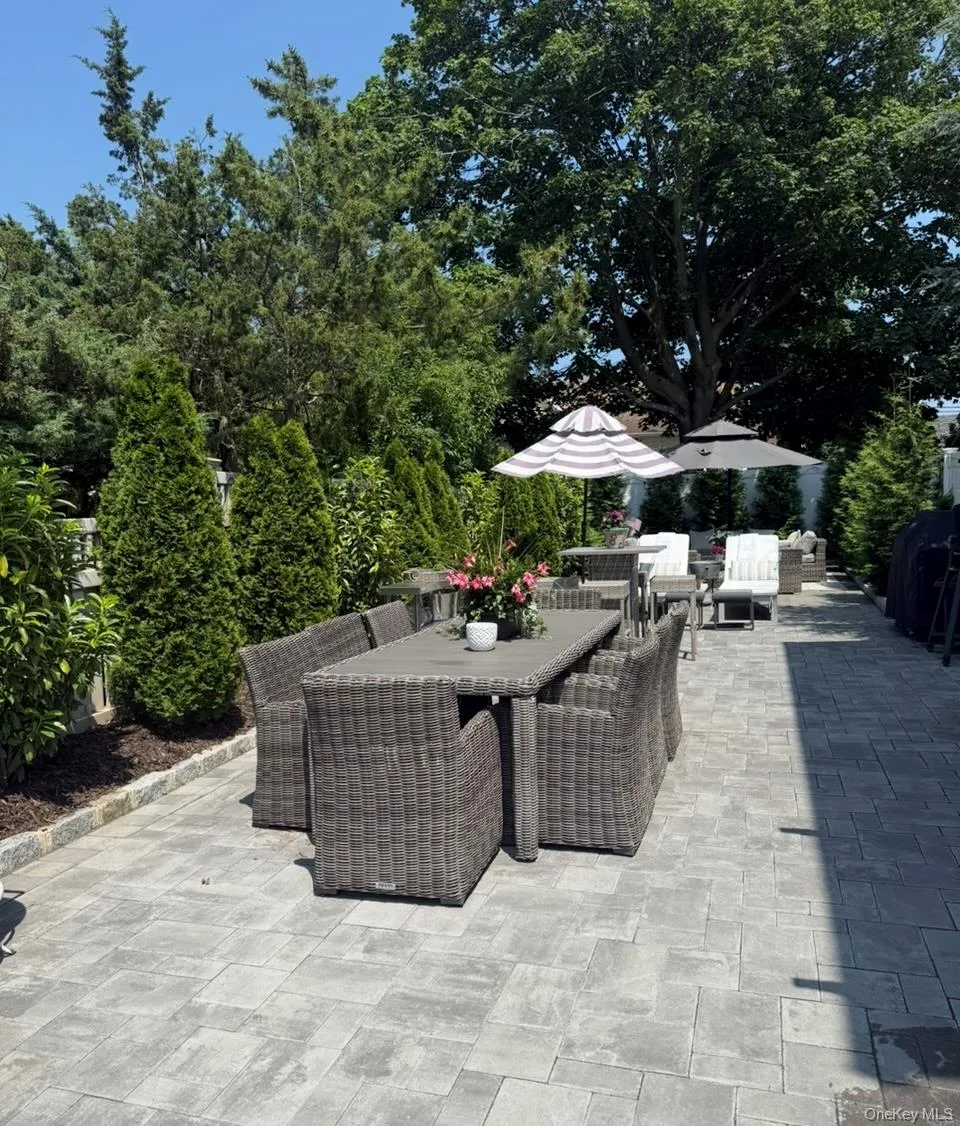 View of patio featuring outdoor dining space View of patio featuring outdoor dining space