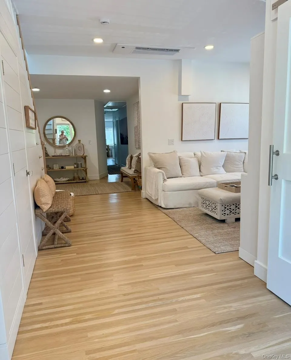 Living room featuring recessed lighting and light wood-type flooring Living room featuring recessed lighting and light wood-type flooring