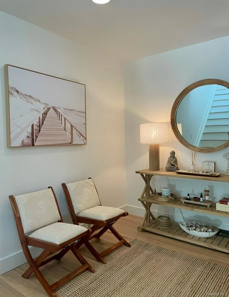 Living area featuring light wood-style flooring and baseboards Living area featuring light wood-style flooring and baseboards