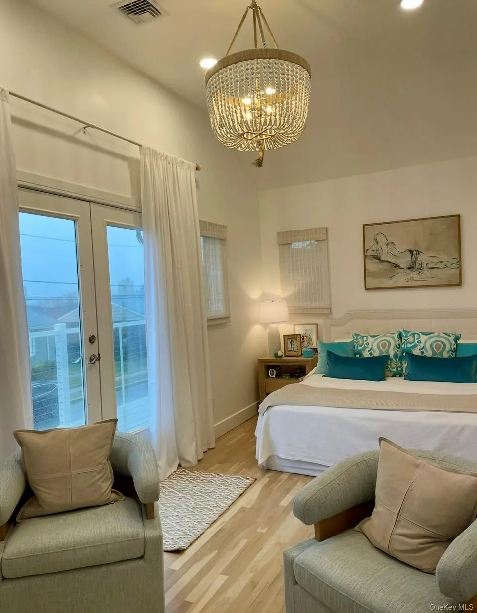 Bedroom featuring access to outside, wood finished floors, recessed lighting, and a chandelier Bedroom featuring access to outside, wood finished floors, recessed lighting, and a chandelier