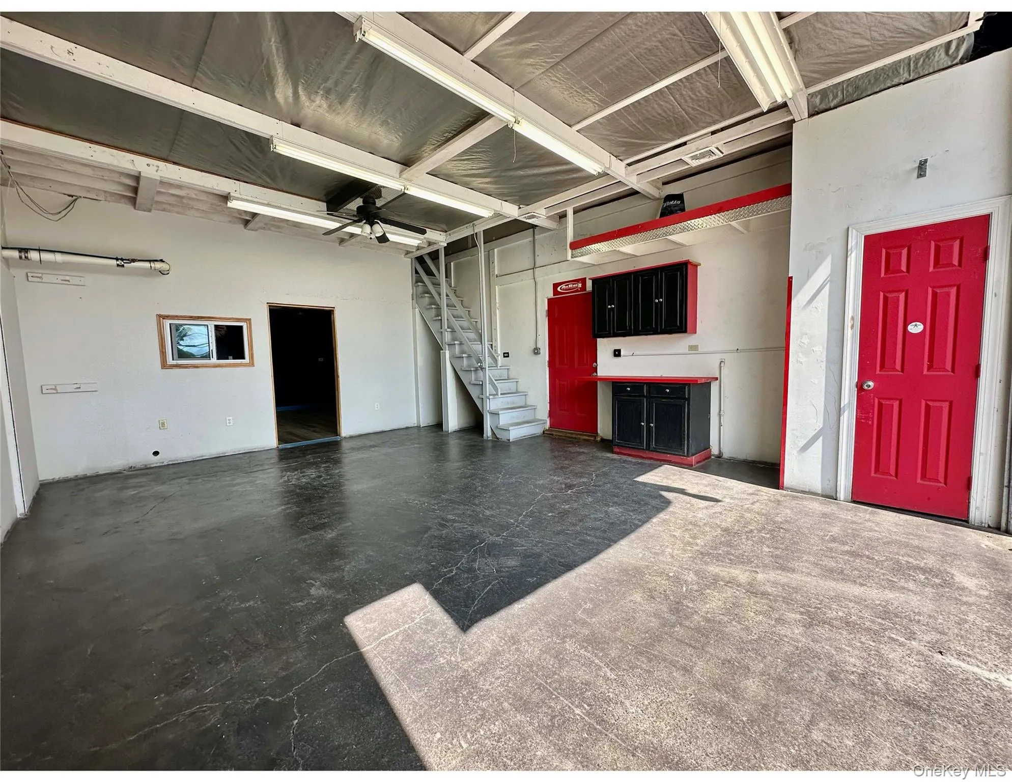 Garage featuring a ceiling fan Garage featuring a ceiling fan