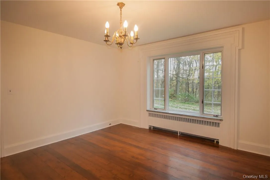 An old fashioned swing door connects the dining room to the country kitchen. An old fashioned swing door connects the dining room to the country kitchen.