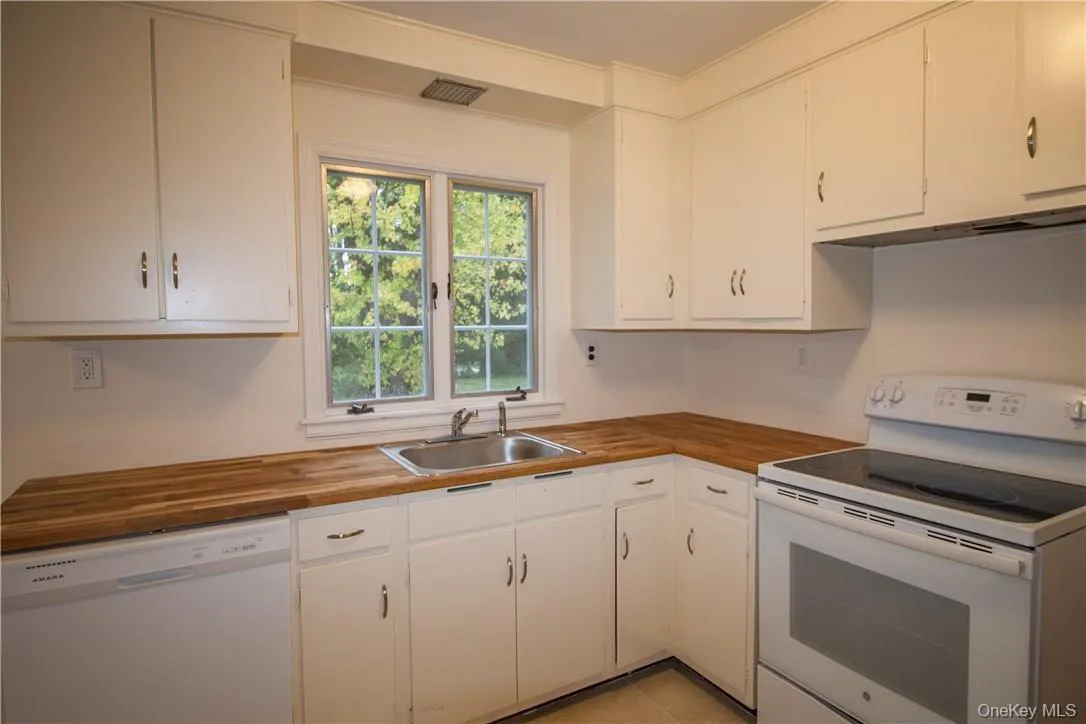 Newly painted cabinets, butcher block counter tops and appliances. Newly painted cabinets, butcher block counter tops and appliances.