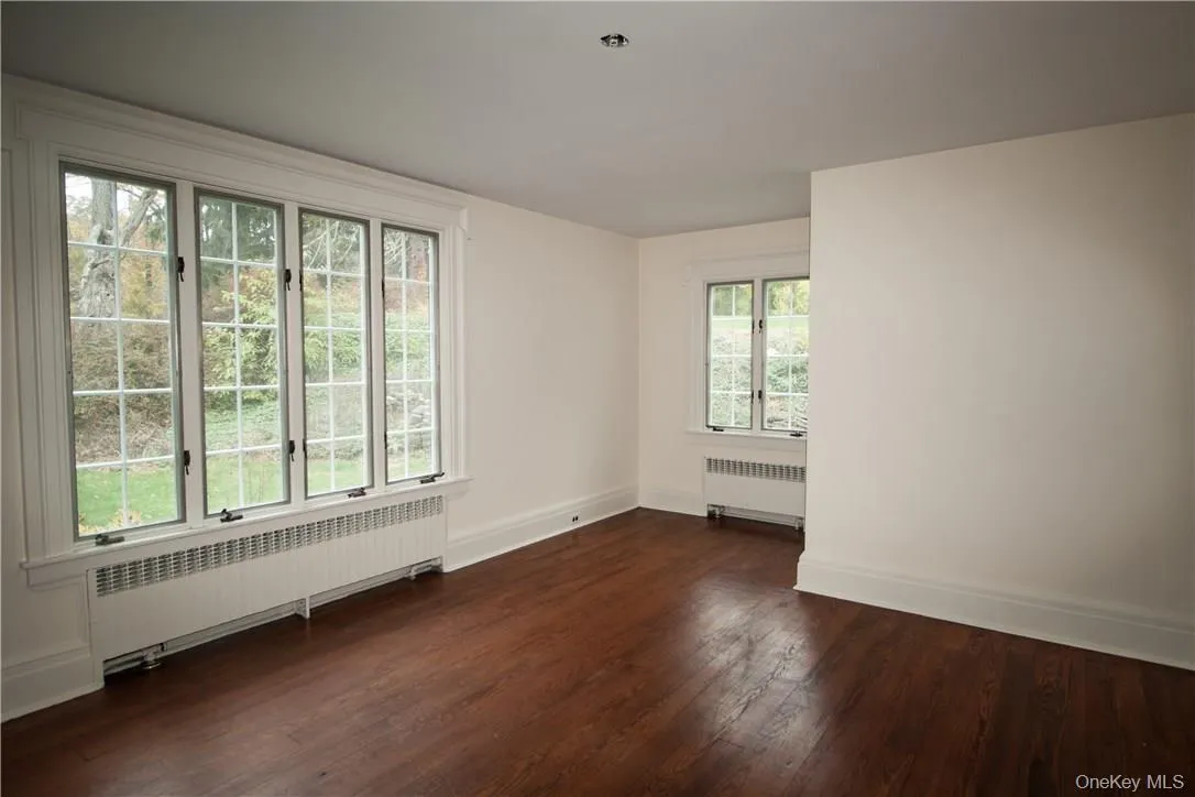 A long hallways leads to the three bedrooms. First bedroom. A long hallways leads to the three bedrooms. First bedroom.