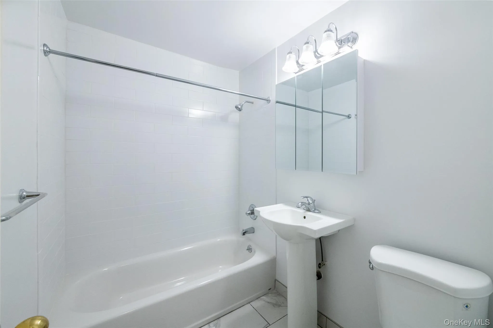 Bathroom featuring shower / bath combination and toilet, tile may vary Bathroom featuring shower / bath combination and toilet, tile may vary