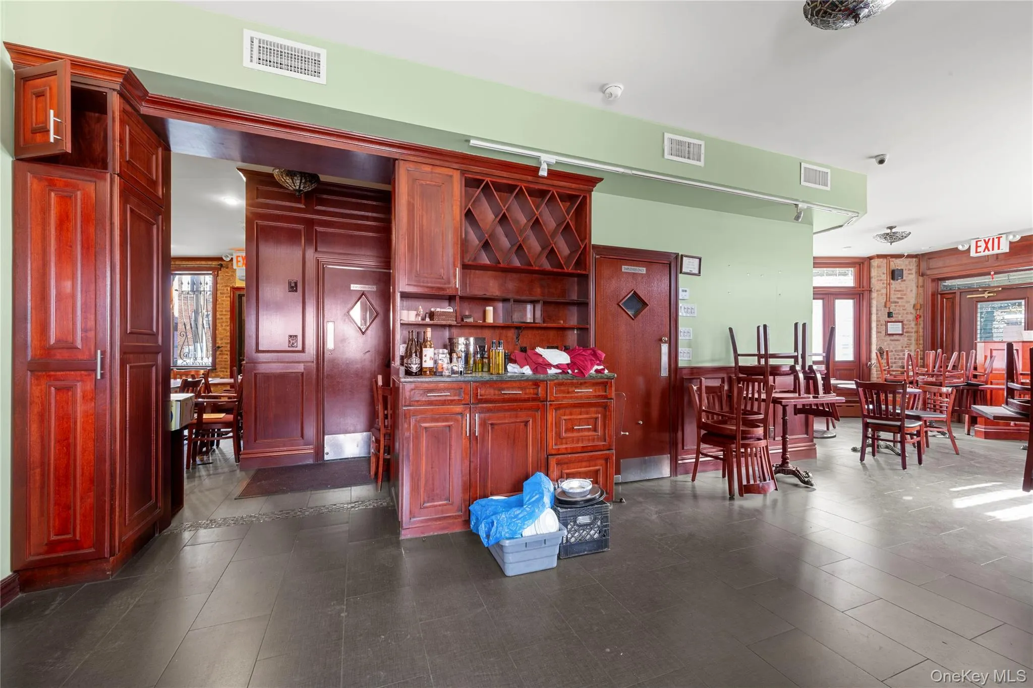 Kitchen featuring dark brown cabinets and open shelves Kitchen featuring dark brown cabinets and open shelves