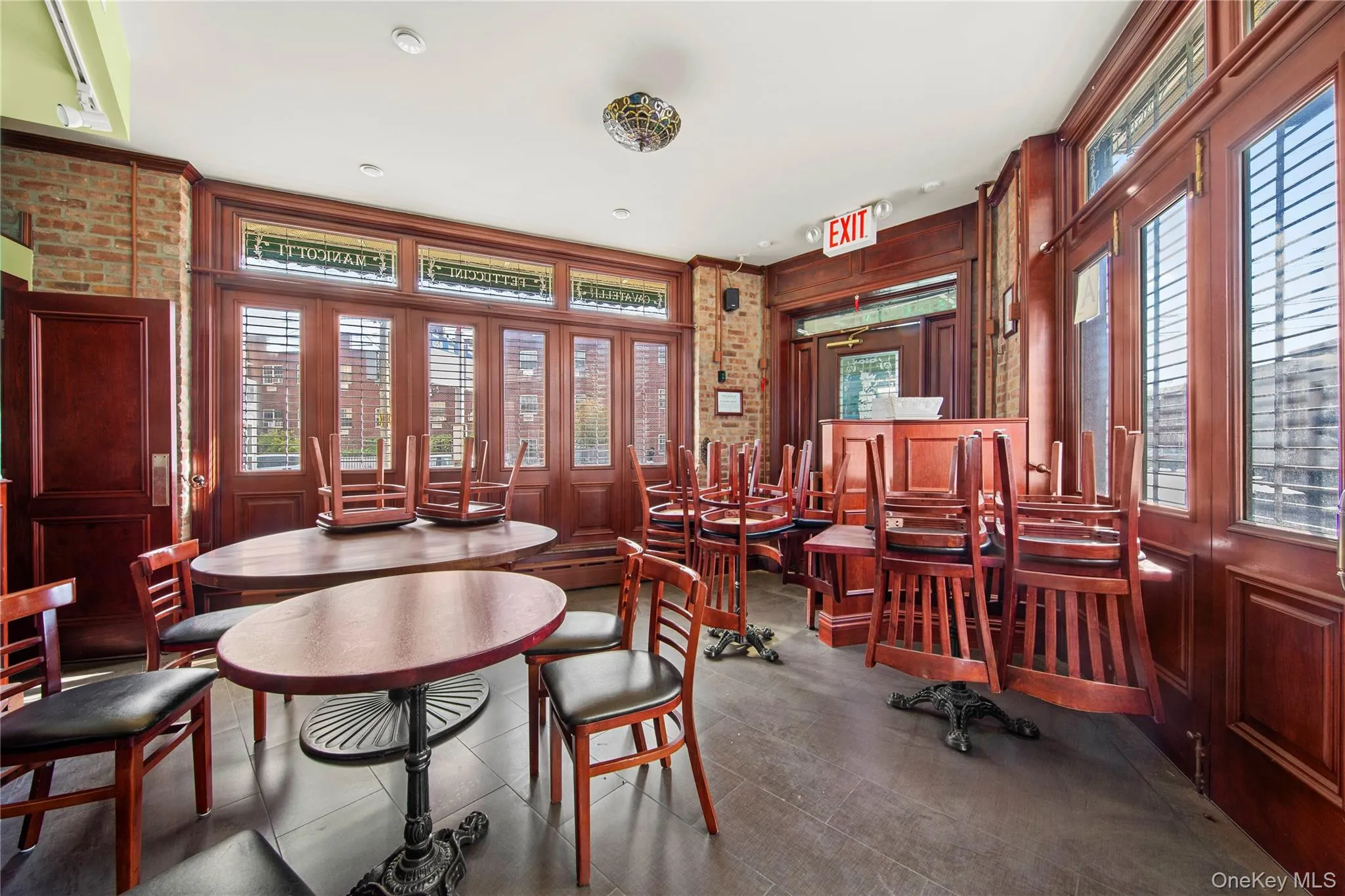 Dining room featuring wood walls Dining room featuring wood walls