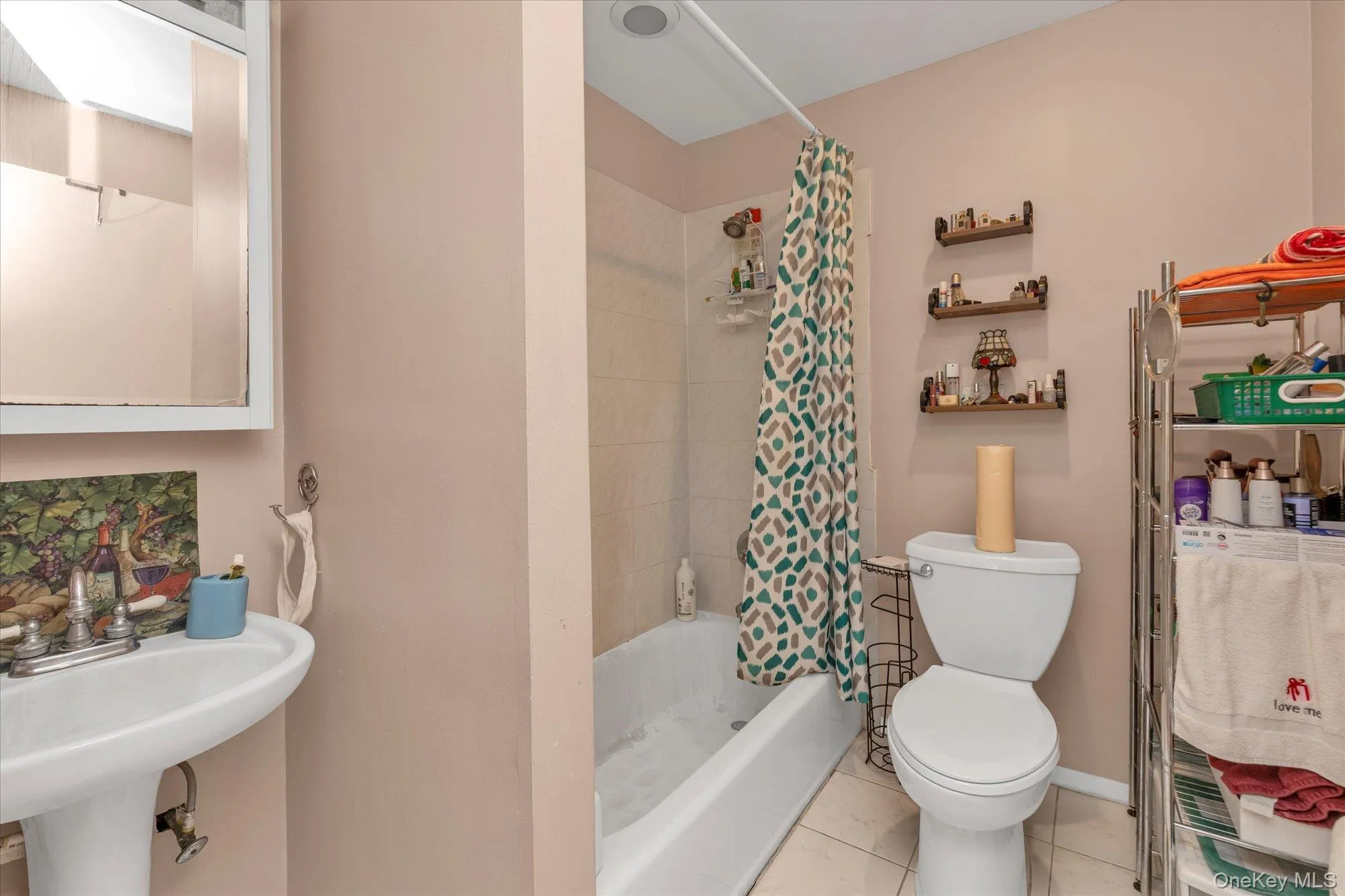 Bathroom with tile patterned floors and shower / tub combo Bathroom with tile patterned floors and shower / tub combo