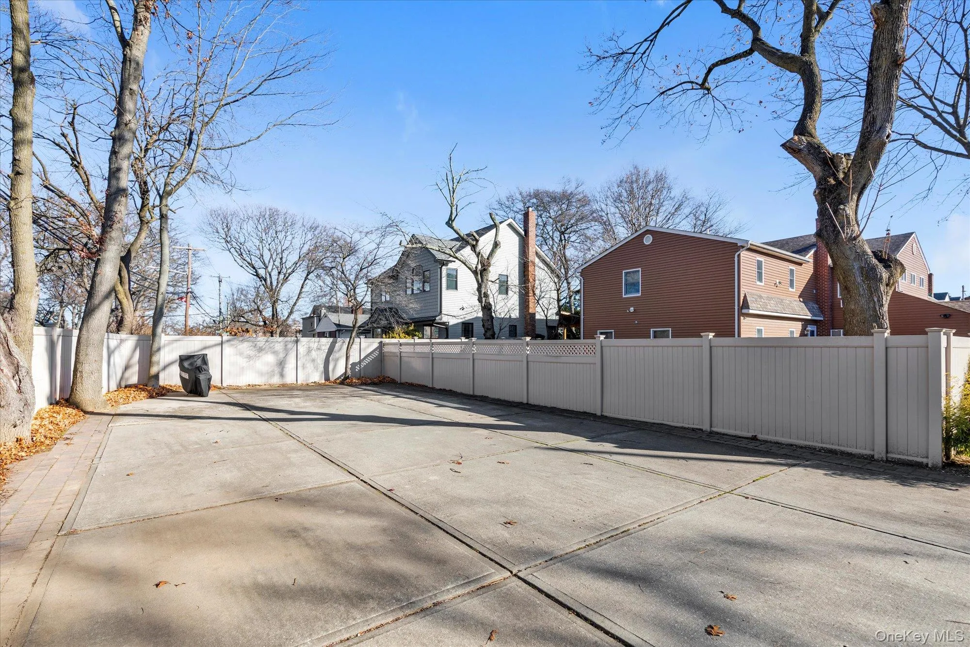 Fenced backyard featuring a residential view Fenced backyard featuring a residential view