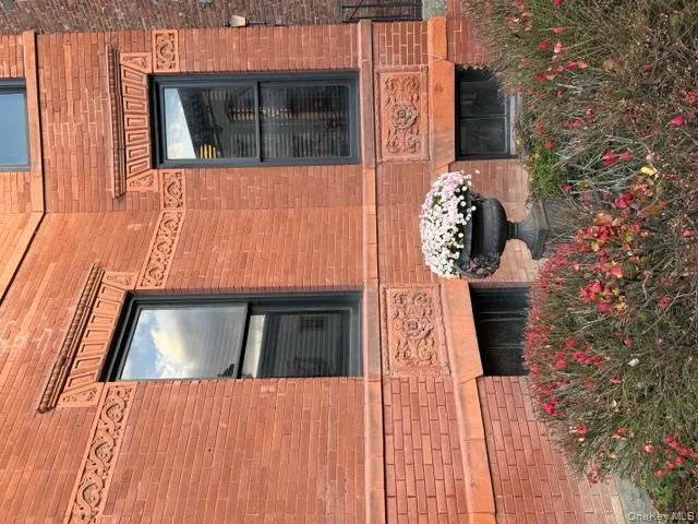View of side of property featuring brick siding View of side of property featuring brick siding
