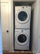 Laundry with stacked washer and clothes dryer Laundry with stacked washer and clothes dryer