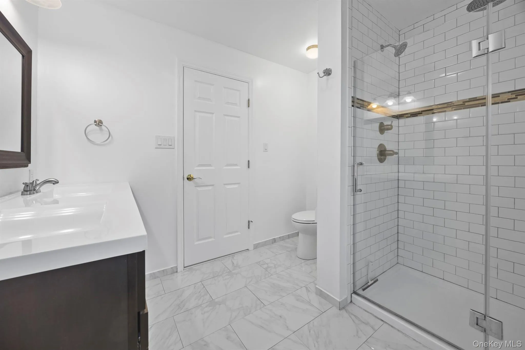 Marble and subway tiled primary bathroom Marble and subway tiled primary bathroom