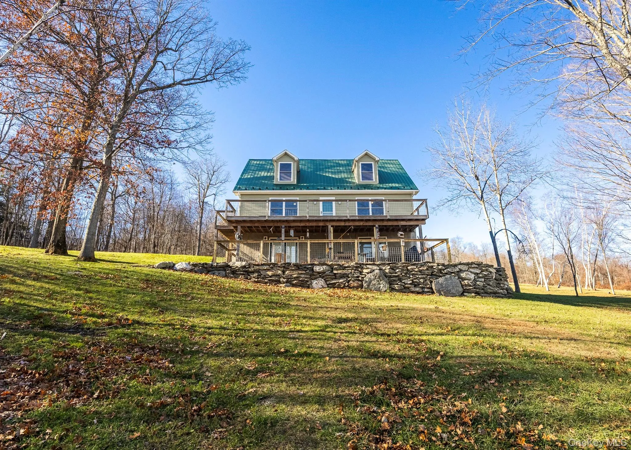 Sloping lawn leading to farm field Sloping lawn leading to farm field
