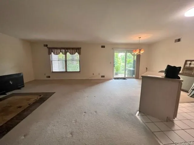 Living room - view of open concept kitchen and living room Living room - view of open concept kitchen and living room