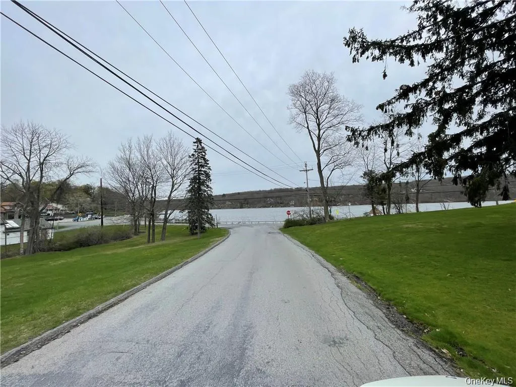 View of asphalt road with a water view View of asphalt road with a water view