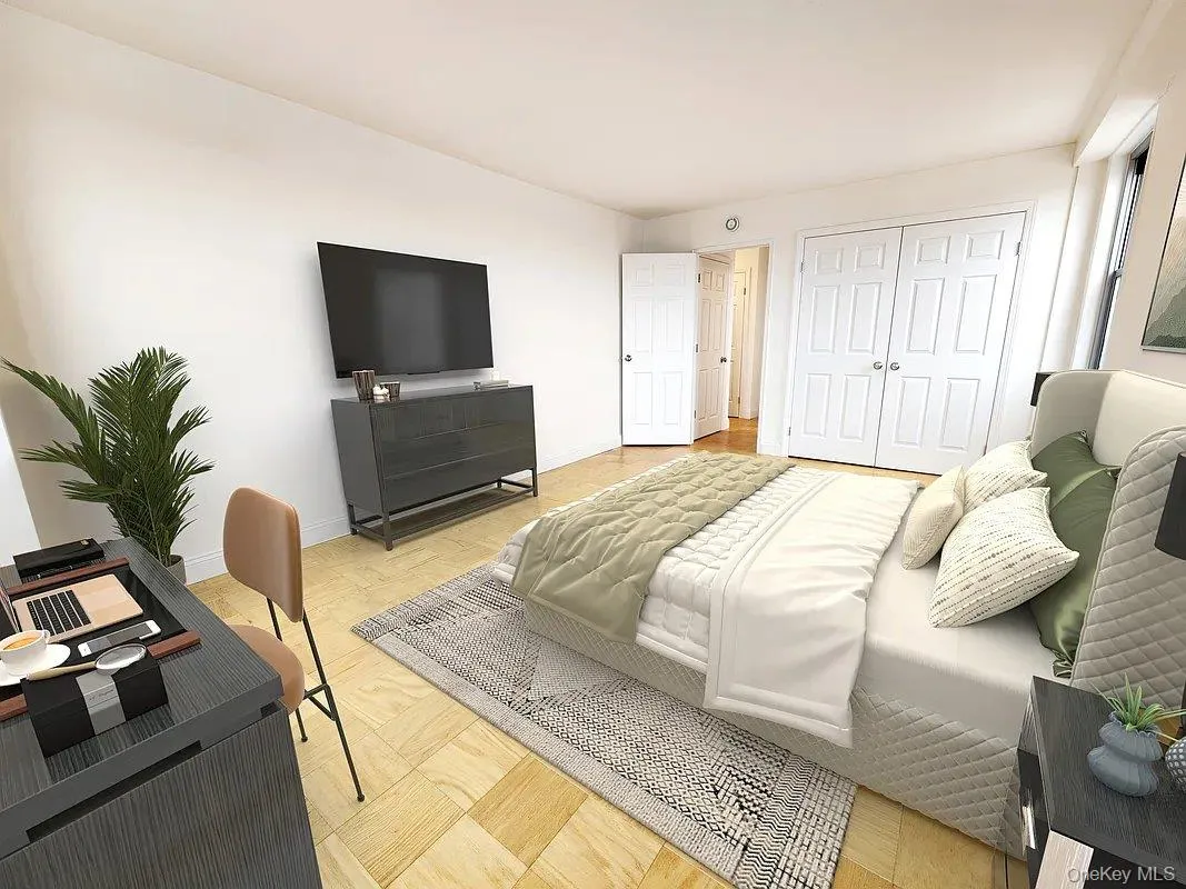 Bedroom with a closet and baseboards Bedroom with a closet and baseboards